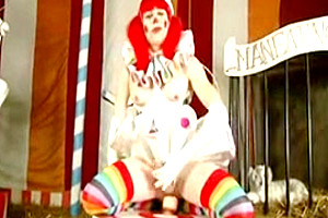 T girl clown takes toy at...